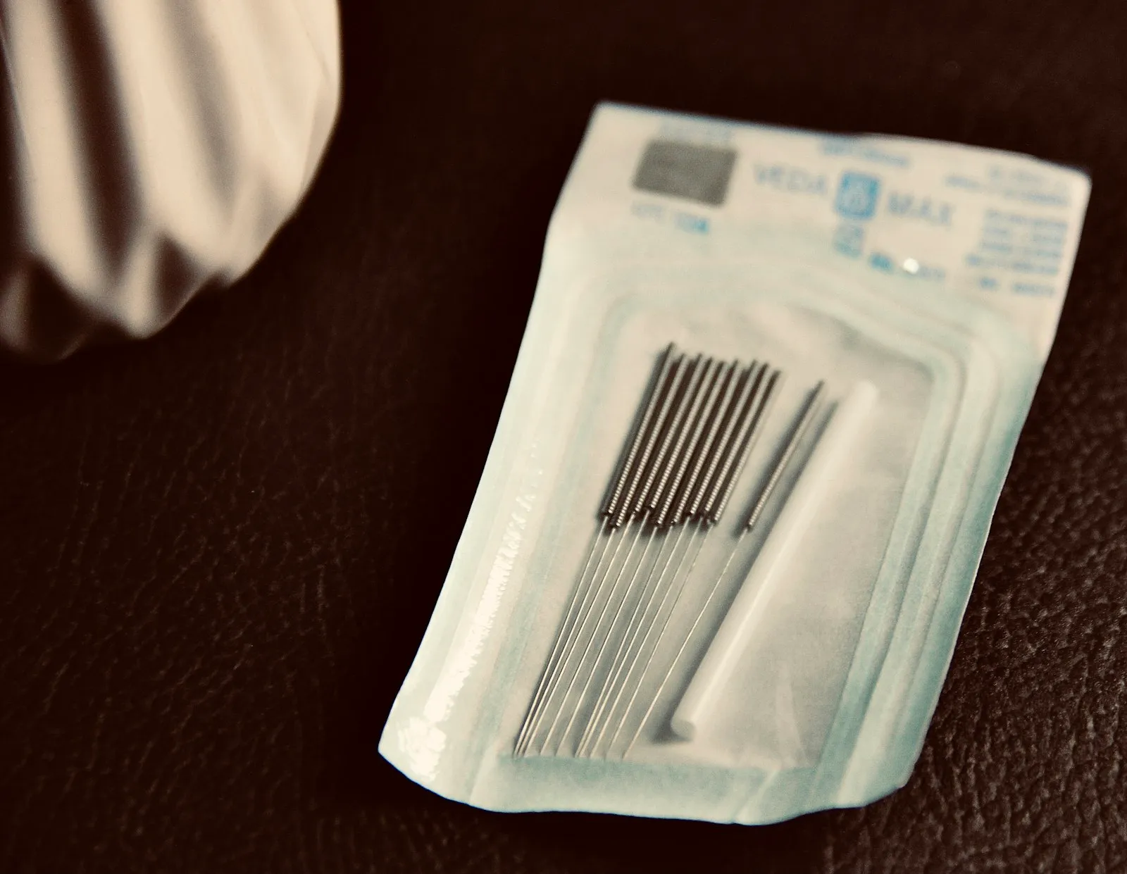 Sterile, single-use acupuncture needles in their packaging