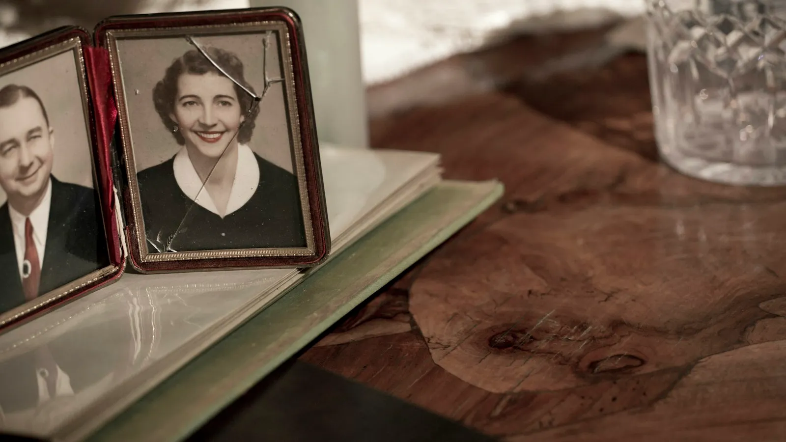 A cherished framed photograph beside a stack of books