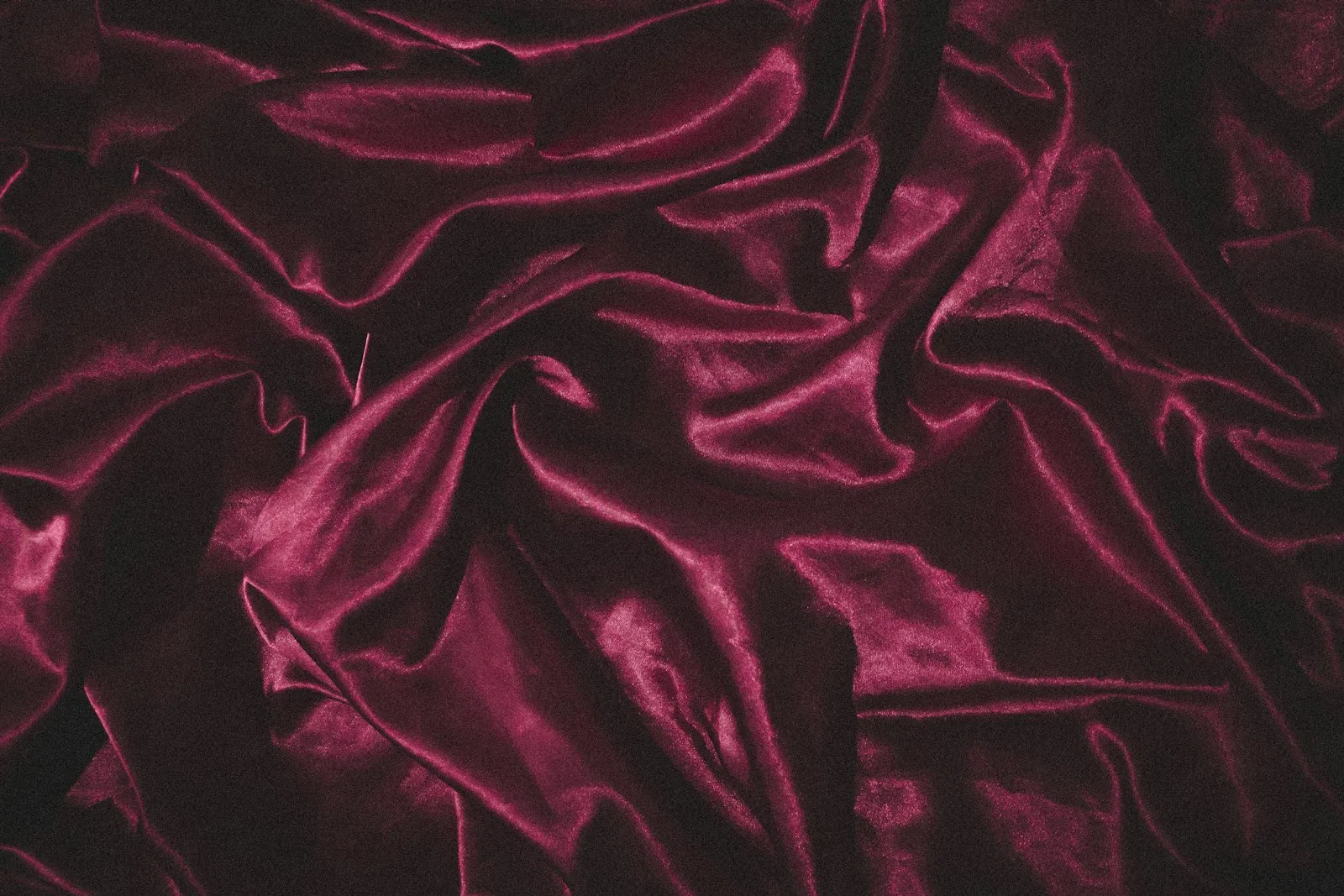Soft folds of deep plum velvet