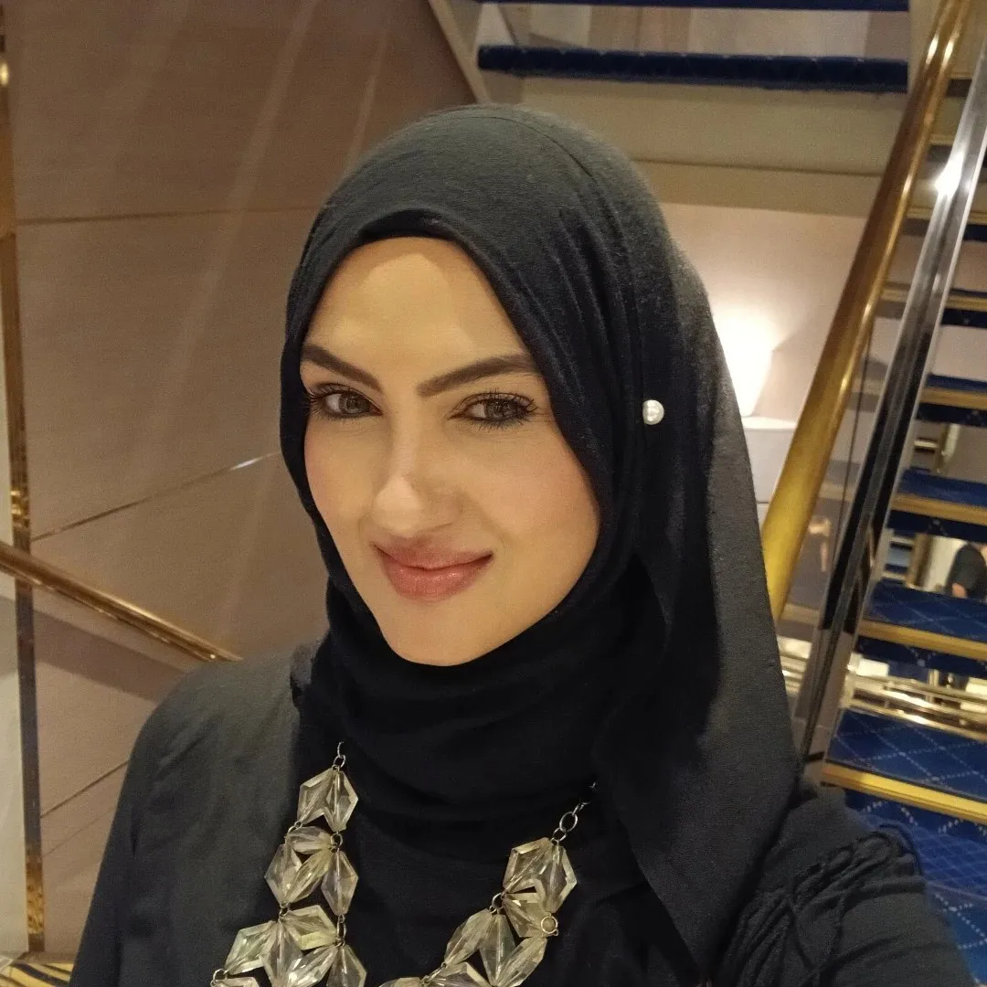 Portrait of Razia Rangrage, smiling